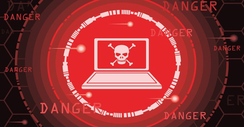 notebook com uma caveira e aviso de perigo